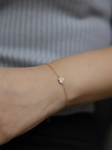 Elegant 14K gold plated S925 silver heart bracelet with pave stones on woman wrist