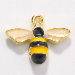 Detail of bee charm with gold frame and yellow glitter wings for DIY jewelry making