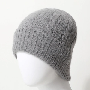 Thick grey cable knit beanie with rolled edges for warmth and winter comfort