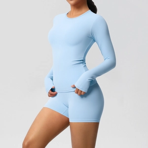 Detail of light blue yoga set with long sleeve thumbhole top and high waist shorts