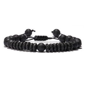 Detailed view of black lava rock beads and adjustable braided rope on the bracelet