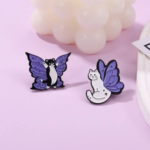 Cute cartoon cat enamel pin with purple butterfly wings on a light purple background