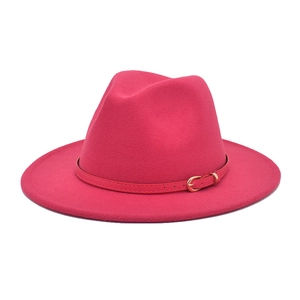 Detail of rose red wool felt fedora with matching leather band and gold metal buckle