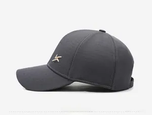 Detail shot of a dark grey winter baseball cap showing premium fabric and side K embroidery