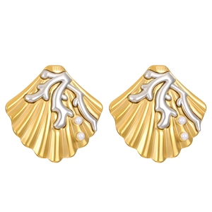 Detail of golden shell-shaped earrings with silver coral branches and small white pearls