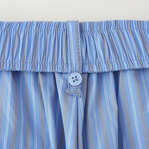 Blue striped loungewear pants with elastic waistband and decorative button detail