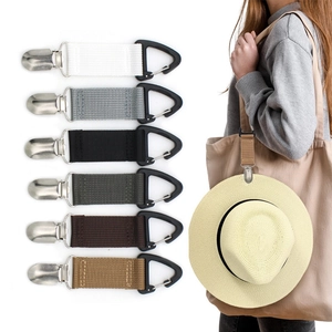Detail of travel hat clips in six colors showing attachment to a tote bag for outdoor use