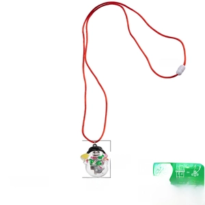 Close-up of a Christmas snowman pendant in resin with adjustable red woven cord necklace