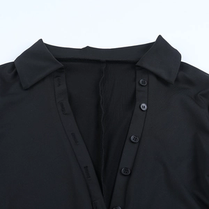 Detail shot of the V-neckline and button-down placket on the black sexy slim bodysuit