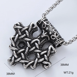 Detail of silver Viking Mjolnir pendant showing 38mm dimensions and complex metal textures
