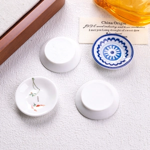 Macro shot of miniature blue and white porcelain plates for dollhouse DIY decor