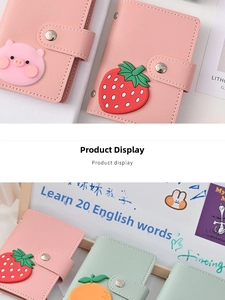 Close-up of macaron color leather card holder with 3D cute strawberry and snap closure