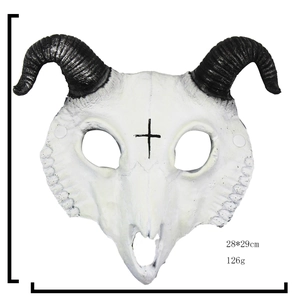 Macro detail of a white goat skull mask with black spiral horns for Halloween party