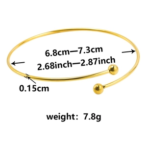 Detailed view of gold stainless steel open bangle showing dimensions 6.8cm to 7.3cm