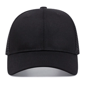 Detailed front view of black trucker cap featuring mesh back and cotton stitch brim