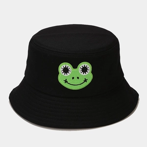 Close-up of green frog embroidery detail on black cotton canvas sun hat for outdoor