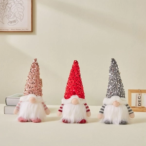 Three Christmas gnomes with sequined hats in pink red and grey for holiday home decor