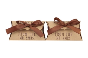Macro detail of kraft paper pillow boxes with dark brown ribbon and Thank You print