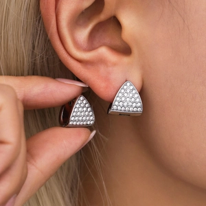 Minimalist silver triangle zirconia star earrings shown on model for stylish look