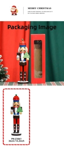 Detailed view of 36cm wooden gingerbread chef nutcracker with gift box packaging