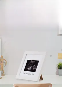 White modern wooden ultrasound frame with Precious Little One text for baby memories