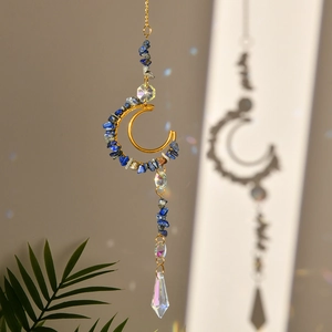 Detail of crescent moon suncatcher with blue crushed stones and faceted crystal prisms