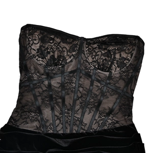 Detail of black lace patchwork corset top with premium velvet fabric and mesh stitching