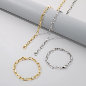 Close-up of gold and silver stainless steel paperclip chain necklaces and bracelets