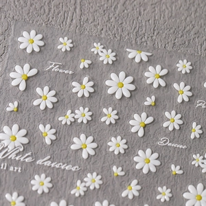 3D relief white daisy nail art stickers with textured floral patterns and yellow centers