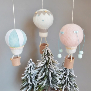 Three wool felt hot air balloon Christmas tree hanging decorations in pastel colors