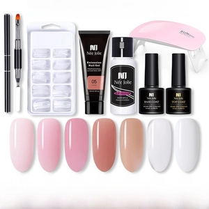 Complete poly nail gel kit with pink UV LED lamp, extension gel, and slip solution tools