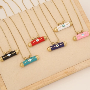 Detailed view of colorful evil eye cylinder pendants on golden chains in six diverse shades