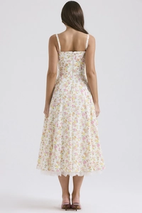 Detailed back view of a floral midi dress with white lace hem and elegant zipper detail