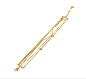 Detail view of multi-layered 18K gold-plated stainless steel snake chain and star charms