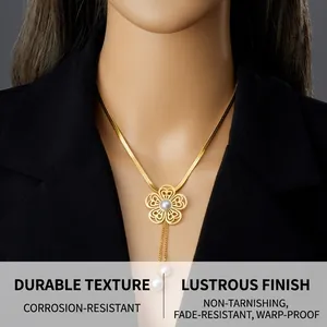 Close-up of golden hollow flower pearl pendant with tassel chain on a model