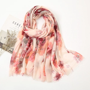 Detail of floral linen cotton scarf with frayed edges and abstract flower print