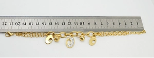 Measuring a gold-plated stainless steel double-layered bracelet with a 21cm steel ruler