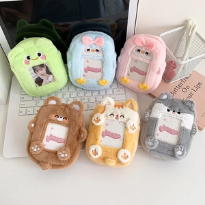 Group view of plush cartoon animal card holders in frog, cat, and bear designs