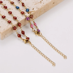 Close-up of glitter heart beads on stainless steel necklaces with adjustable lobster clasp