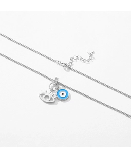 Detailed shot of S925 silver necklace featuring enamel evil eye and hollow eye charms
