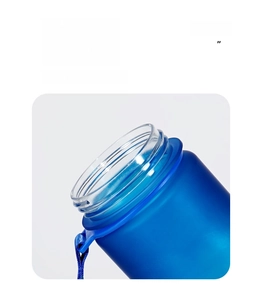 Detailed macro view of the smooth rounded rim and fabric strap of the 32oz water bottle