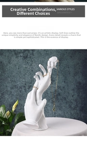 Detailed view of white resin hand-shaped jewelry stand for rings and necklaces display