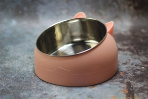 Detail view of pink cat-ear shaped bowl with tilted stainless steel inner for neck protection