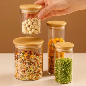 Set of four borosilicate glass airtight food jars with bamboo lids for kitchen storage
