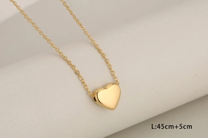 Detail showing golden heart pendant necklace with length 45cm plus 5cm extension chain