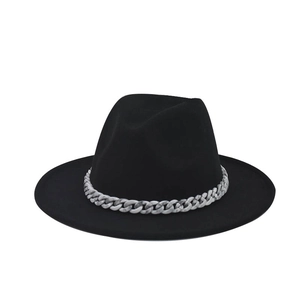 Detail of black wool fedora hat featuring a chunky marble-patterned decorative chain