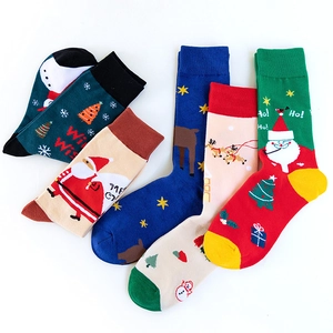 Five pairs of Christmas cotton socks featuring Santa Claus, reindeer, and snowflakes patterns