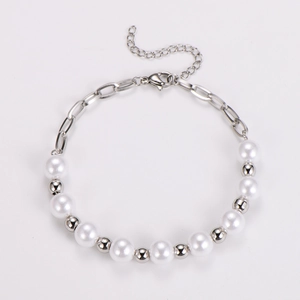 Detail of minimalist stainless steel bracelet featuring pearls and silver beads on O-chain