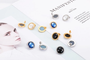Detailed view of colorful round crystal stud earrings with gold and silver metal bases