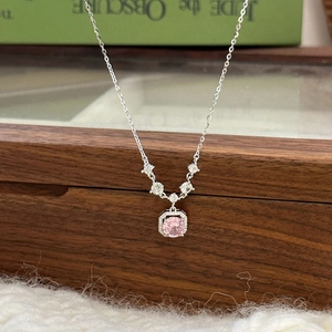 Elegant S925 sterling silver necklace with a pink square zircon pendant on a book